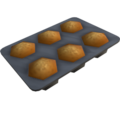 A muffin tray with cooked muffins in it.